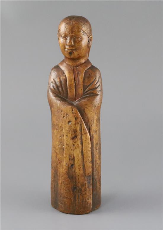 A Chinese wood figure of a sage or scholar, Qing dynasty, H.26cm
